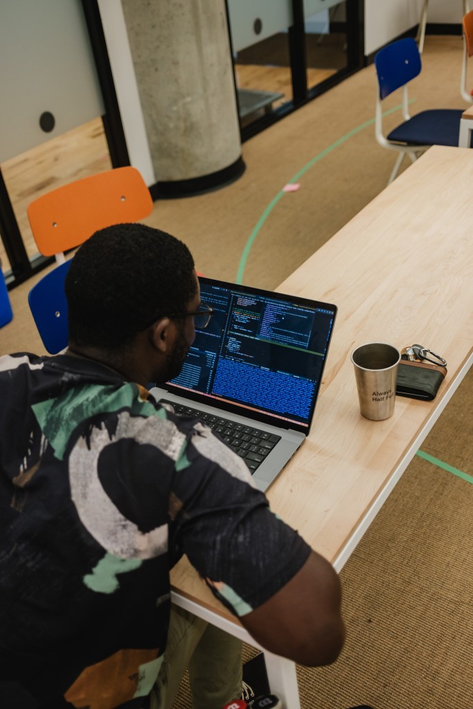 Software engineer at work, debugging code.