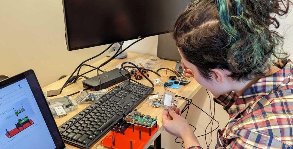 Mona setting up some hardware for the hackathon